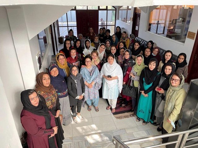 A group of women gathered during an activity documented in ADVO’s supplied organisational materials